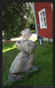 Sculputure in the entrance of one building in Koli Village 